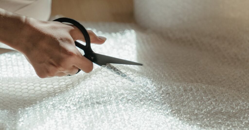 Person in White Long Sleeve Shirt Holding Black Framed Eyeglasses